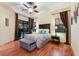 Bright main bedroom boasts wood floors, ceiling fan and private access to the outdoor pool at 3902 162Nd E Ave, Parrish, FL 34219