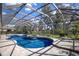 Beautiful screened-in pool is surrounded by a spacious deck and lush landscaping for a serene and private outdoor space at 3902 162Nd E Ave, Parrish, FL 34219