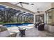 Enjoy the outdoors by this lovely screened-in pool and patio with plenty of space for outdoor seating and relaxation at 3902 162Nd E Ave, Parrish, FL 34219