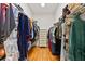 Walk-in closet with custom shelving and hanging space for organization at 3902 162Nd E Ave, Parrish, FL 34219
