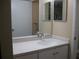 Updated bathroom with a single sink vanity and modern fixtures, enhancing the home's appeal at 4460 Ironwood Cir # 505Ad, Bradenton, FL 34209