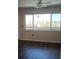 The living room has a large window offering plenty of natural light and pleasant neighborhood views at 4460 Ironwood Cir # 505Ad, Bradenton, FL 34209