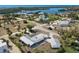 Gorgeous aerial view of coastal property with mature landscaping and waterways, featuring a private drive and metal roof at 45 Cape Haze Dr, Placida, FL 33946