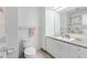 Clean bathroom featuring a vanity, mirror, and tiled walls around the toilet and shower at 45 Cape Haze Dr, Placida, FL 33946