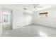 Neutral bedroom featuring a ceiling fan, and closet with double doors at 45 Cape Haze Dr, Placida, FL 33946