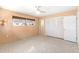 Peach bedroom featuring a window, closet with double doors and concrete flooring at 45 Cape Haze Dr, Placida, FL 33946