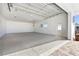 Large, clean garage space with bright lighting, finished floors, and a roll-up door, perfect for multiple vehicles at 45 Cape Haze Dr, Placida, FL 33946