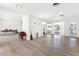Spacious living room with hardwood floors, white walls and ceilings, and large sliding doors leading to the outdoors at 45 Cape Haze Dr, Placida, FL 33946