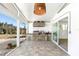 Outdoor kitchen featuring a built-in grill, countertop space, and a tiled floor at 45 Cape Haze Dr, Placida, FL 33946