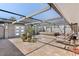 Inviting outdoor patio space with a translucent roof, comfortable lounge furniture, and decorative potted plants at 45 Cape Haze Dr, Placida, FL 33946