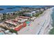 Exceptional aerial shot of beachfront condos, tennis courts, and easy beach access at 4621 Gulf Of Mexico Dr # 19B, Longboat Key, FL 34228