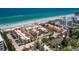 Expansive aerial view featuring condos, tennis courts, beachfront access, and parking at 4621 Gulf Of Mexico Dr # 19B, Longboat Key, FL 34228