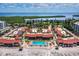 Beautiful aerial view of beachfront condos with a pool, beach access, and ocean view at 4621 Gulf Of Mexico Dr # 19B, Longboat Key, FL 34228