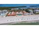 Breathtaking aerial view of oceanfront condos with a pristine beach and clear blue waters at 4621 Gulf Of Mexico Dr # 19B, Longboat Key, FL 34228
