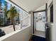 Inviting condo entrance featuring an open doorway and glimpse of a charming foyer at 4621 Gulf Of Mexico Dr # 19B, Longboat Key, FL 34228