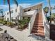 Well-maintained condo exterior with classic design and inviting entrance with landscaped stairs at 4621 Gulf Of Mexico Dr # 19B, Longboat Key, FL 34228