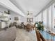 The living room features tile floors, a ceiling fan and access to the dining area and kitchen at 4621 Gulf Of Mexico Dr # 19B, Longboat Key, FL 34228