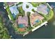 Beautiful waterfront property with pristine landscaping, mature palms, and waterfront access at 5007 Palermo Dr, Punta Gorda, FL 33950
