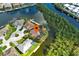 Waterfront home showcasing lush landscaping, private dock, and tranquil canal views at 5007 Palermo Dr, Punta Gorda, FL 33950