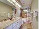 Bathroom with granite counters, tile floors, and shower at 5007 Palermo Dr, Punta Gorda, FL 33950