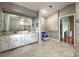 Spacious bathroom with large mirror, accessible features, and walk-in shower at 5007 Palermo Dr, Punta Gorda, FL 33950