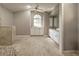 Bright bathroom features large window, double vanity, and updated shower with neutral tiling at 5007 Palermo Dr, Punta Gorda, FL 33950