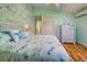 Bedroom featuring themed wall art, wood floors, closet, and ceiling fan at 5007 Palermo Dr, Punta Gorda, FL 33950