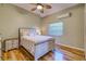 Bedroom with wood floors, ceiling fan, and natural light at 5007 Palermo Dr, Punta Gorda, FL 33950