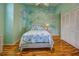 Bedroom featuring themed wall art, wood floors, closet, ceiling fan and window at 5007 Palermo Dr, Punta Gorda, FL 33950