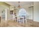 Dining area with natural light, travertine floors, open concept, and chandelier lighting at 5007 Palermo Dr, Punta Gorda, FL 33950