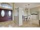 Open concept, showing front door and dining area with travertine floors, lots of light and high ceilings at 5007 Palermo Dr, Punta Gorda, FL 33950