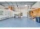 Garage with epoxy floor, shelving, and a ladder at 5007 Palermo Dr, Punta Gorda, FL 33950