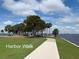 Scenic Harbor Walk featuring a paved path next to the water on a bright and sunny day at 5007 Palermo Dr, Punta Gorda, FL 33950