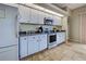 Kitchen featuring stainless steel appliances, granite counters, and white cabinets at 5007 Palermo Dr, Punta Gorda, FL 33950