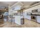 Kitchen with stainless steel appliances, granite counters, white cabinets and tile floors at 5007 Palermo Dr, Punta Gorda, FL 33950