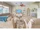 Comfortable living room with tile flooring, ceiling fan, and sliding glass doors to the lanai at 5007 Palermo Dr, Punta Gorda, FL 33950