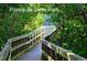 Wood boardwalk through lush greenery at Ponce de Leon Park at 5007 Palermo Dr, Punta Gorda, FL 33950
