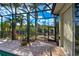 Screened-in pool area with brick pavers, landscaping, and view of waterway at 5007 Palermo Dr, Punta Gorda, FL 33950