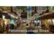 Indoor shops decorated with lights and banners, adding a festive touch at 5007 Palermo Dr, Punta Gorda, FL 33950