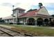 Historic Punta Gorda train station featuring red tile roof and brick accents along the arched entryways at 5007 Palermo Dr, Punta Gorda, FL 33950