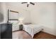 Cozy bedroom with hardwood floors, dresser, and a bright window at 5112 52Nd W Ave, Bradenton, FL 34210