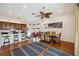 The dining room is open to the kitchen and living room and has a large fan at 5112 52Nd W Ave, Bradenton, FL 34210