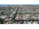Stunning aerial view of a waterfront property with a beautiful pool and private dock, nestled in a serene canal community by the bay at 5169 Sandy Shore Ave, Sarasota, FL 34242