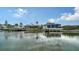 Waterfront home boasting private boat docks, lifts, and clear canal access at 5169 Sandy Shore Ave, Sarasota, FL 34242