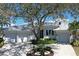 Stunning single-story home with a three-car garage and meticulously maintained landscaping at 5169 Sandy Shore Ave, Sarasota, FL 34242