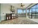 Outdoor kitchen with granite countertops, stainless steel appliances, and views of the water at 5169 Sandy Shore Ave, Sarasota, FL 34242