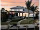 Beautiful waterfront home featuring a private dock, screened lanai, and lush landscaping, perfect for outdoor living at 5169 Sandy Shore Ave, Sarasota, FL 34242