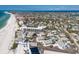 Overhead landscape view of a neighborhood on a beach with a mix of commercial and residential properties at 5400 Gulf Dr # 25, Holmes Beach, FL 34217