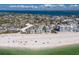 A beautiful aerial view of homes along the coastline near a beach with gorgeous water views at 5400 Gulf Dr # 25, Holmes Beach, FL 34217