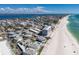 Stunning aerial view of housing near a beach with beautiful water views and blue skies above at 5400 Gulf Dr # 25, Holmes Beach, FL 34217